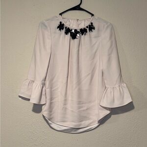 Elegant Cream Blouse with Black Embellishments